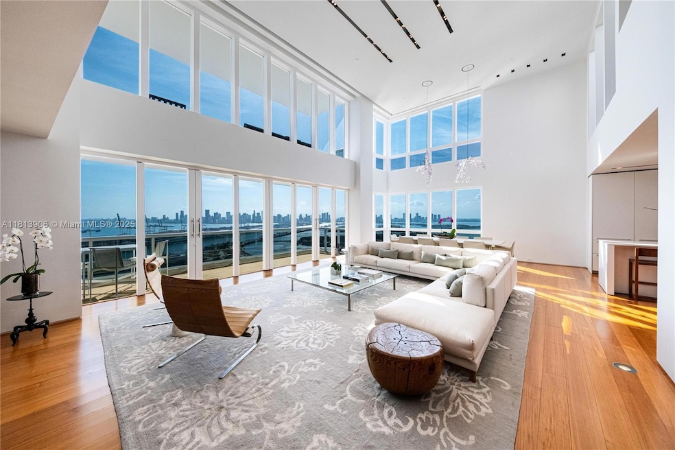 From the moment you arrive at Penthouse A, you're welcomed by soaring 20-foot ceilings and awe-inspiring, unobstructed views of the dazzling Miami skyline.