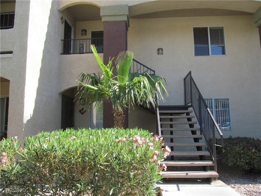 Entrance to property featuring stucco siding