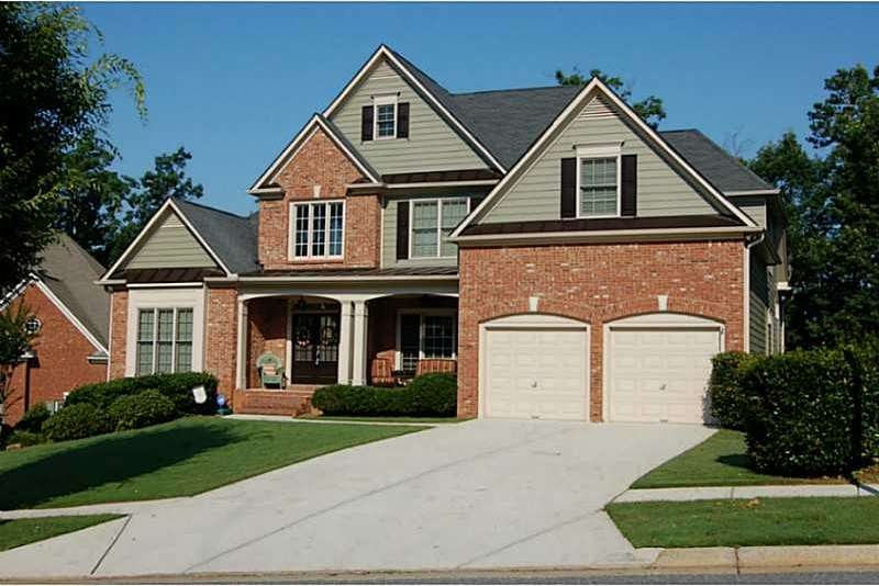 Exterior Front. Beautiful brick & frame home on cu