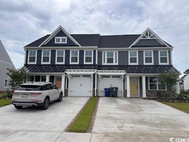View of front of property featuring a garage