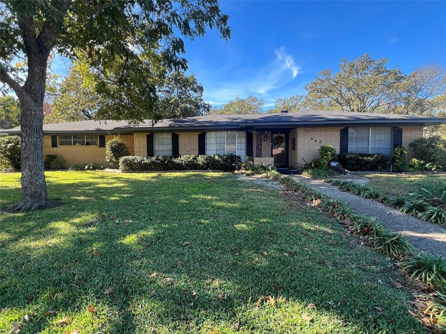 Ranch-style house featuring a front lawn