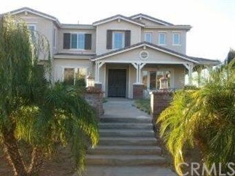 Front view of house with wrap around porch