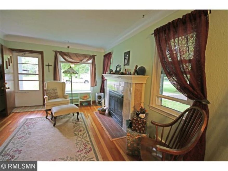 Gleaming woods and graceful coved ceilings complim