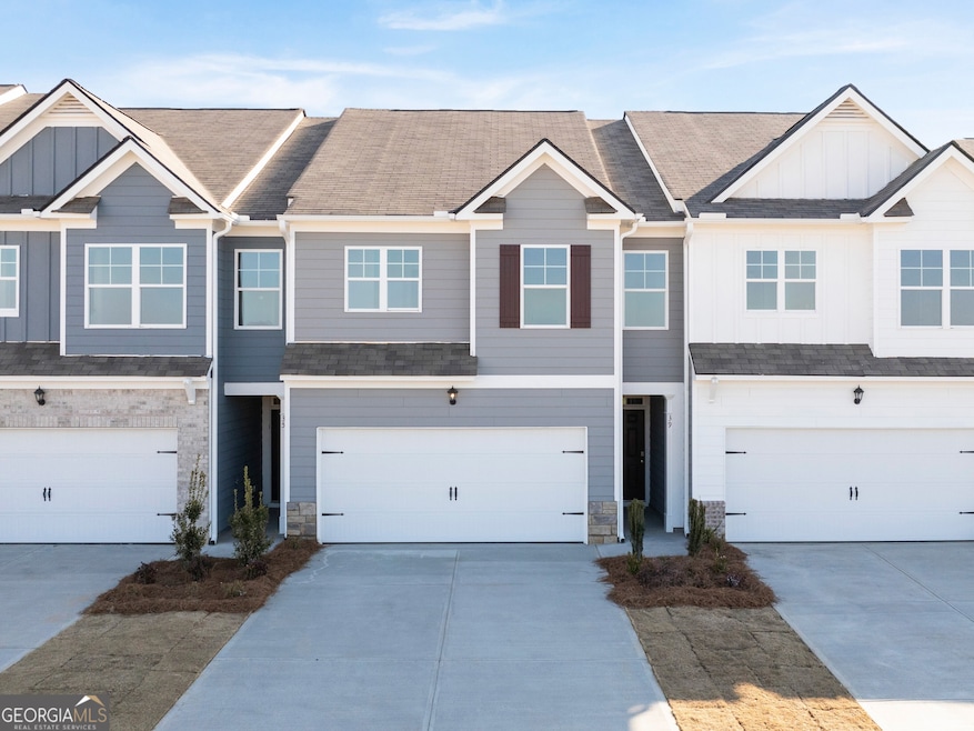 Two story townhome with two car garage and front f