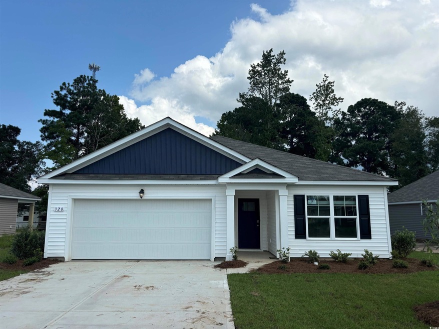 View of front of house with a garage and a front l