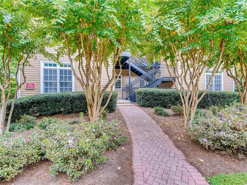 Set back among professional landscaping--this coul