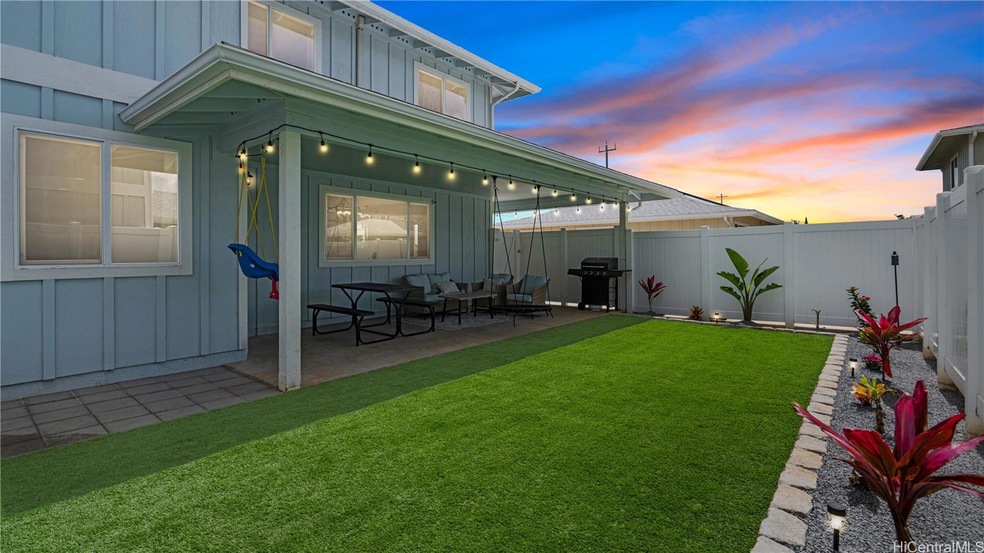 Thoughtful touches to the fenced back yard make it