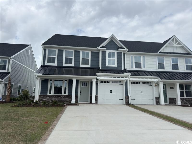 View of front of house featuring a standing seam r