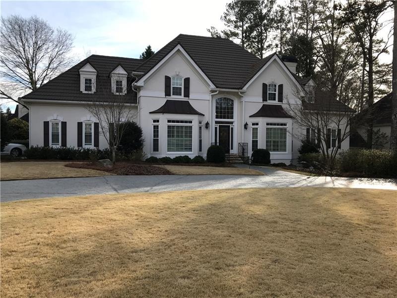 Gracious executive home with custom paved circular