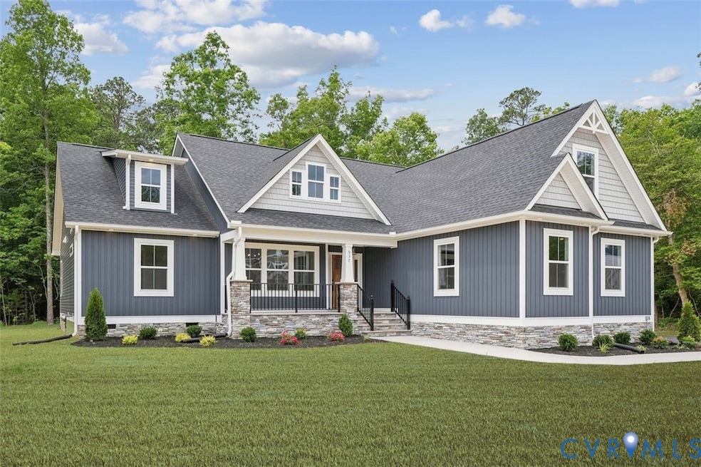 Craftsman-style house featuring a shingled roof, covered porch, a front lawn, and crawl space
