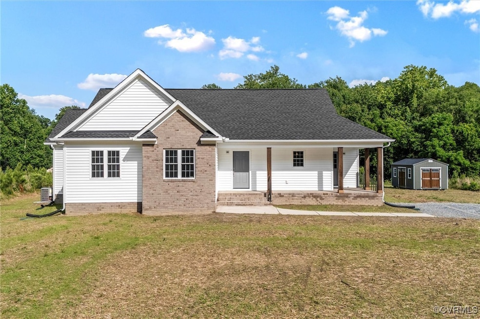 View of front of house featuring a shed, a porch,