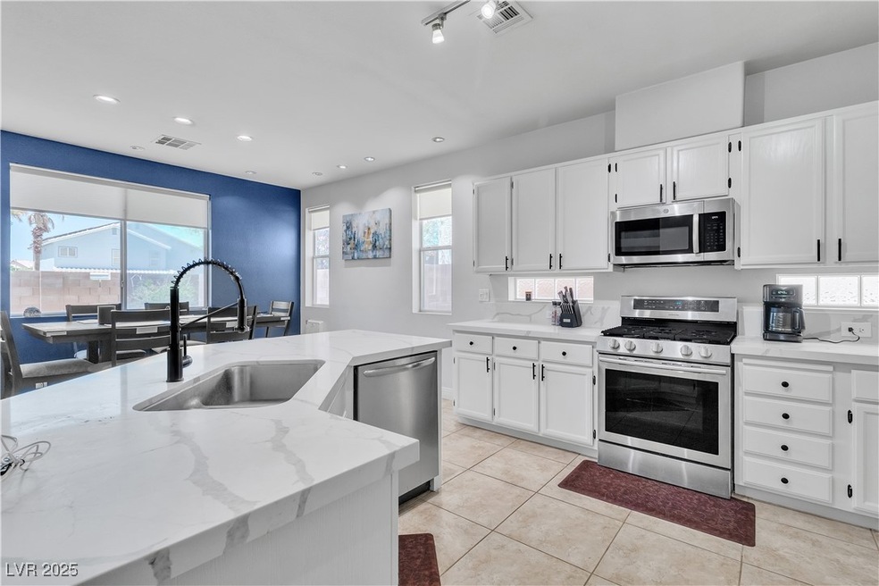 Kitchen with appliances with stainless steel finis