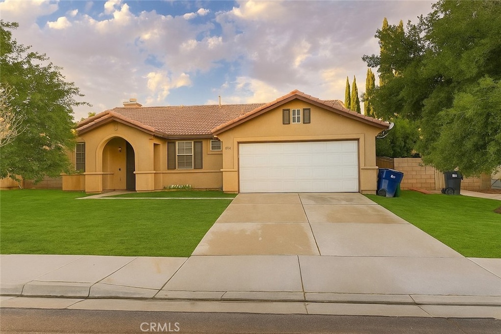 Photo enhanced for marketing purposes. Home does not have grass in the front yard.