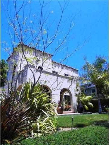 Situated above the street this regal Spanish home 
