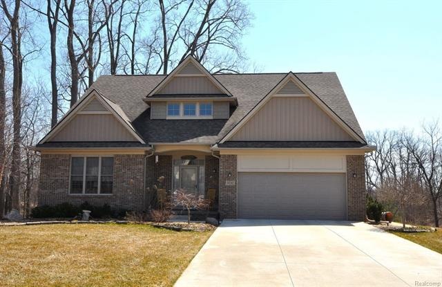 Nestled in private park setting backing to woods a