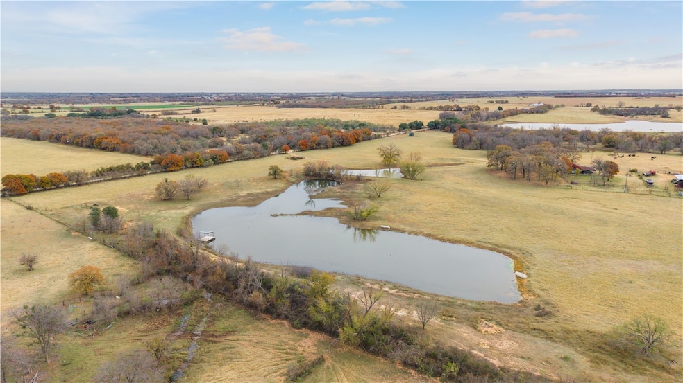 Birds eye view of property with a rural view and a