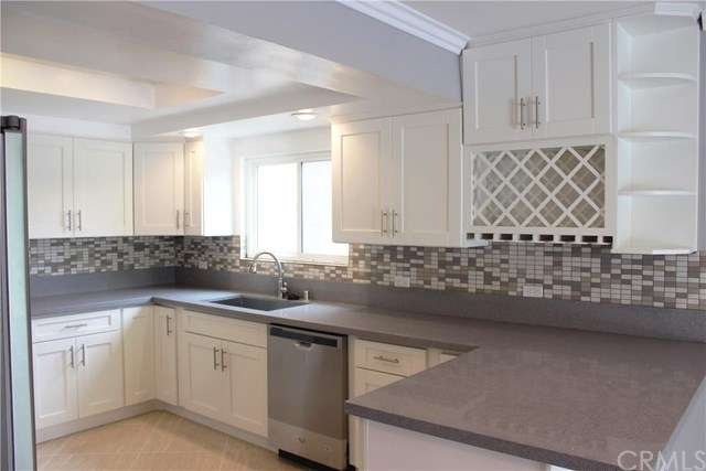 Stunning kitchen with quartz counter top and gray 