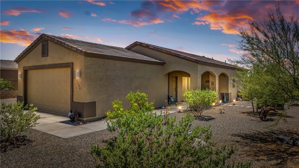 View of front of property featuring an attached ga
