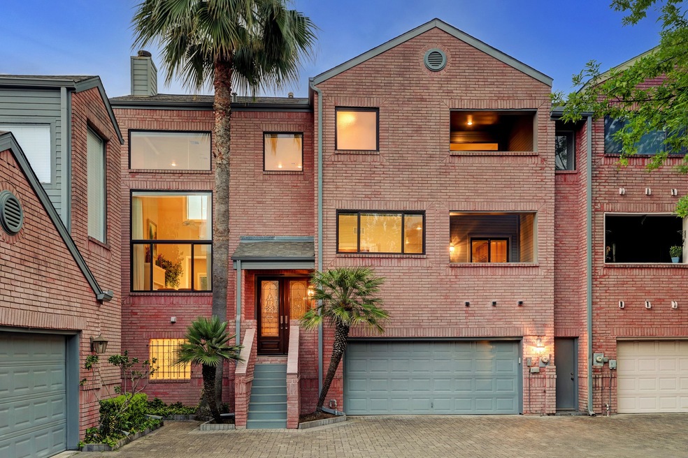 Quietly located back off the street in an stylish community of 5 homes, this updated well maintained home boasts striking curb appeal of solid brick & artful lines! Raised covered entry boasts a beautiful mahogany & glass double front door, 2 covered balconies, 2 car attached garage & huge paver stone drive for easy maneuverability, convenience & lots of off street parking! Too many upgrades to list, but a few include all NEW double pane windows, recent roof, updated baths/kitchen, hardwoods and on & on!