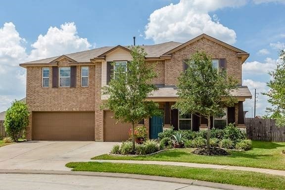 Located on a quiet cul-de-sac in the Tamarron community is this beautiful 2-story home balancing classic and contemporary design features with its brick finish and clean lines. The lush green landscaping provides a stunning contrast to the brick facade.