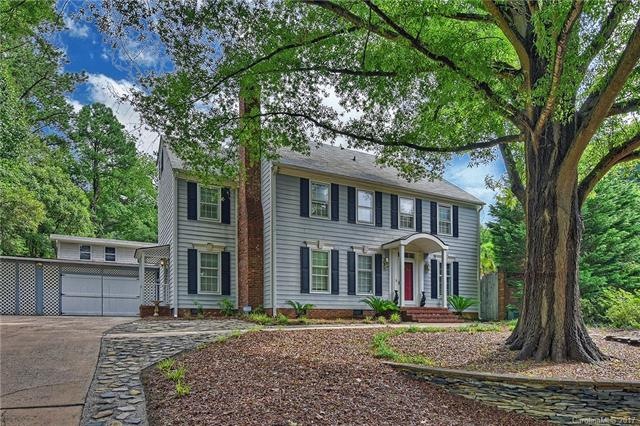 Beautiful curb appeal with mature trees and expand
