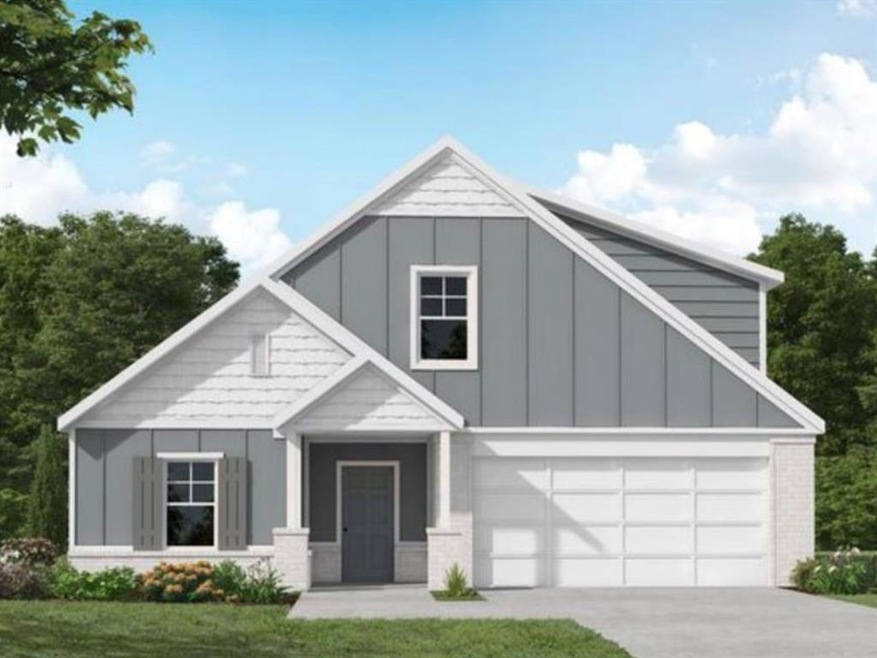 View of front facade with a garage and a front yar