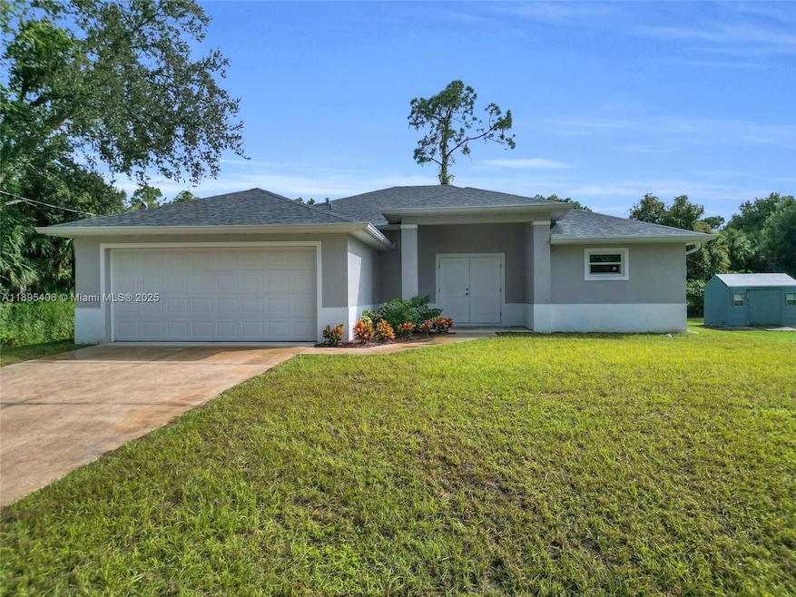 1006 Asther St E, Lehigh Acres, FL 33974 - photo 1