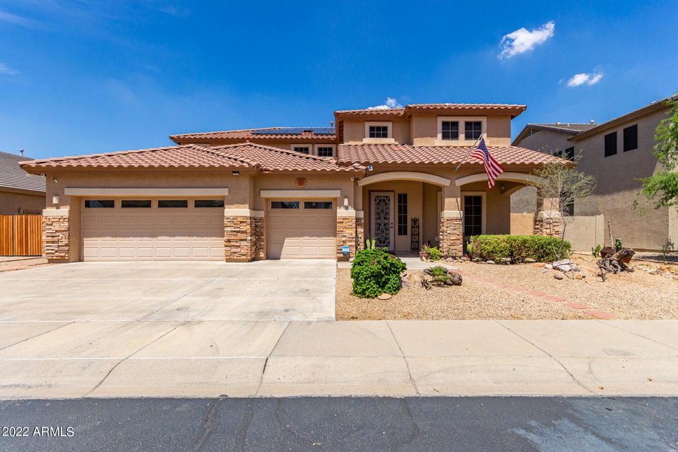 Desert landscape with 3 car garage