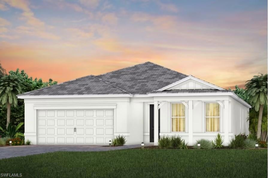 View of front of property featuring a garage and a