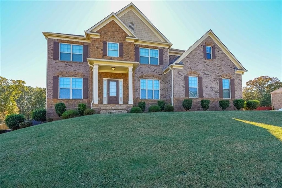Craftsman-style house with a front yard
