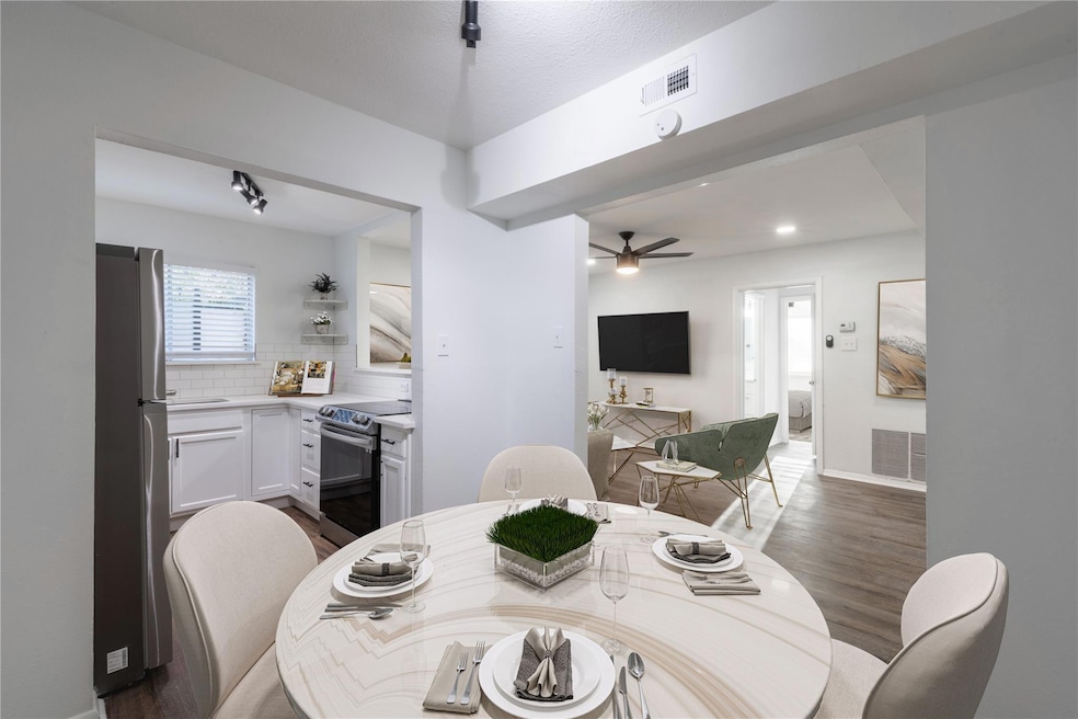 Dining area featuring baseboards, visible vents, w