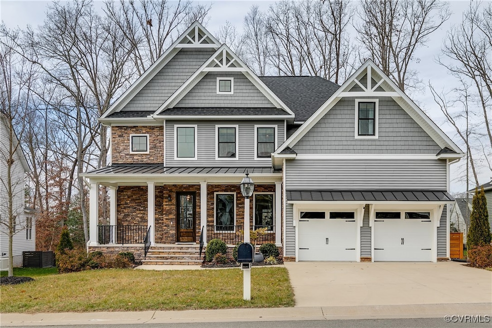 Craftsman-style house with covered porch, a garage