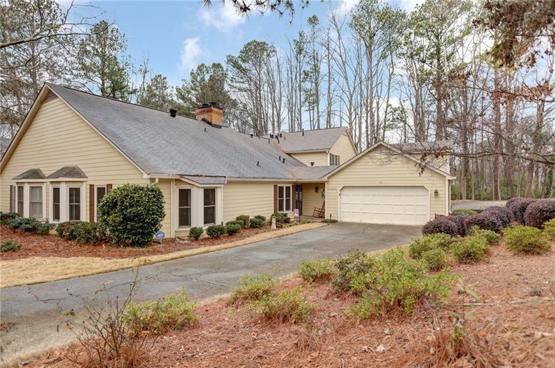 The wonderful level driveway leads to an over size