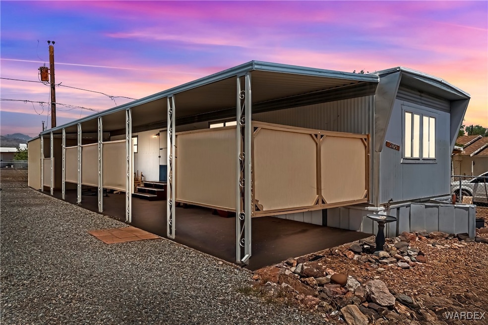 View of property exterior at dusk