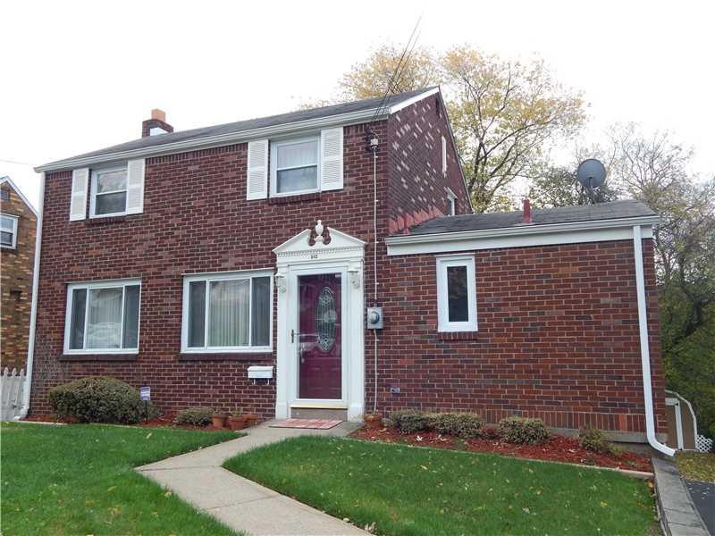 Facade/Exterior Front. Front of Home with Yard Vie