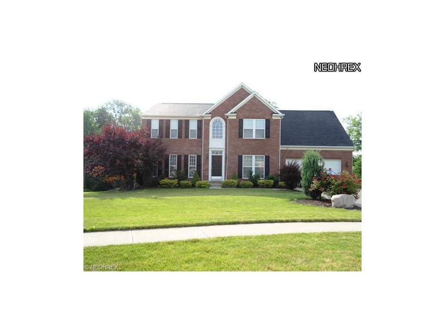 Attractively landscaped brick-front cul-de-sac hom