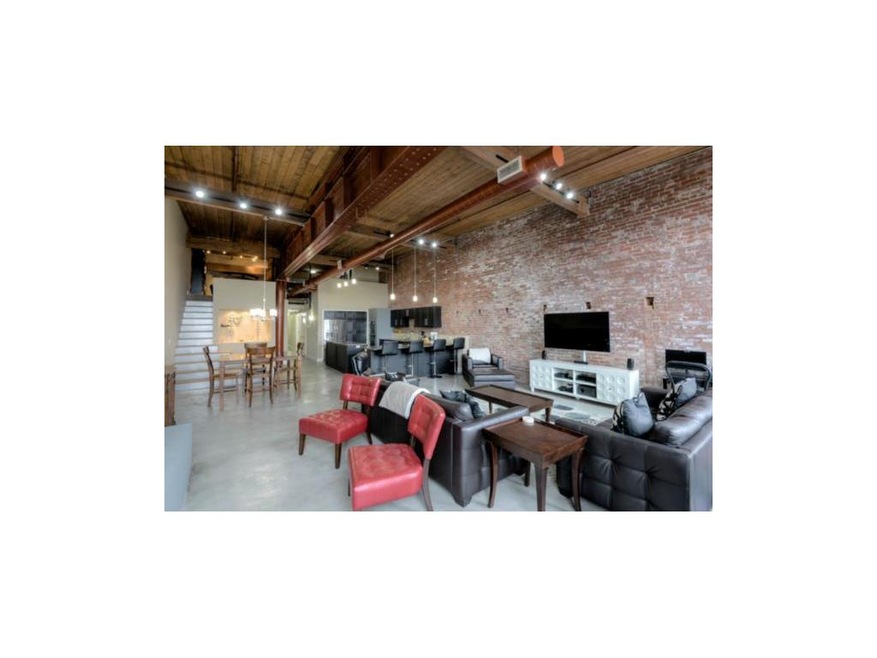 Tradition Home Group-Exposed brick walls and beams