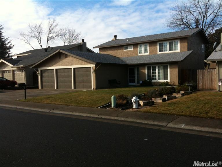 Front elevation.  Oversized 3 car garage with stor