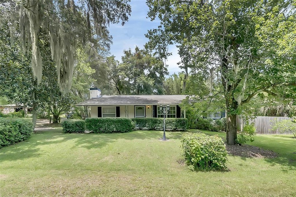 Front view, large front yard with beautiful trees