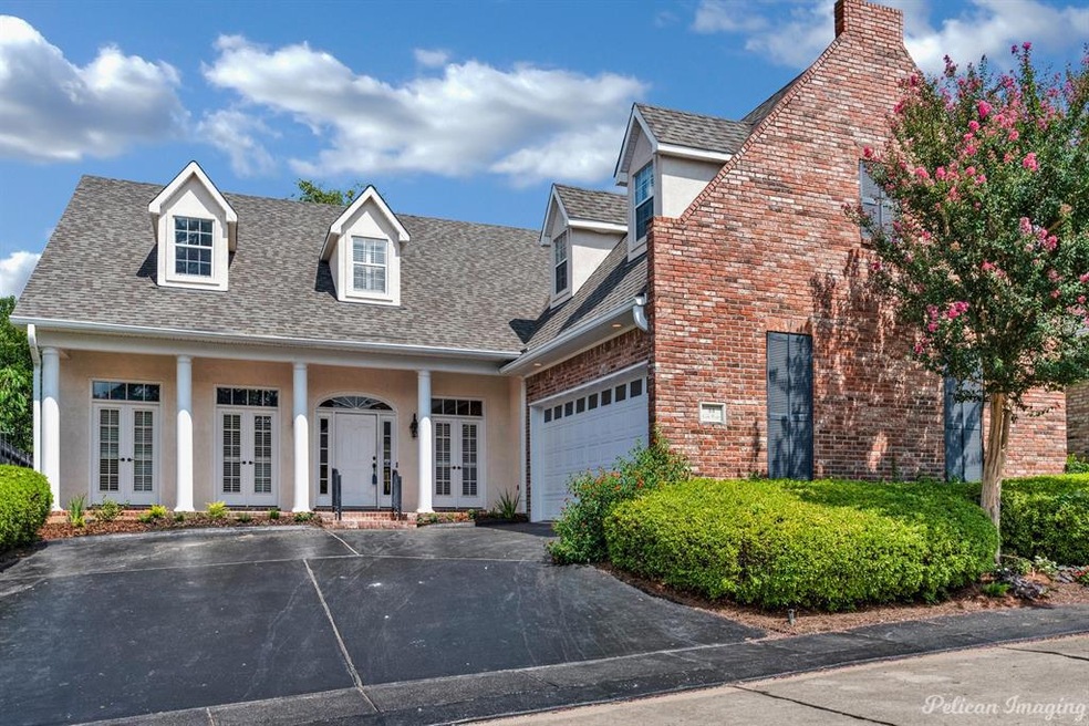 Located in the gated community of Lake Place.