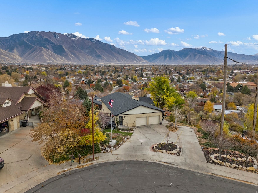 Aerial perspective of suburban area featuring a mountain backdrop
