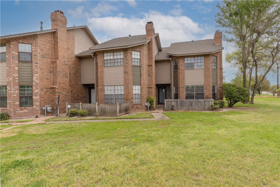 View of front of property with a front yard and a