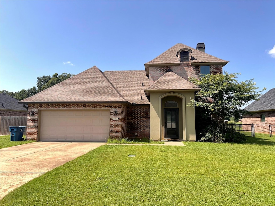 View of front of home featuring a garage and a fro