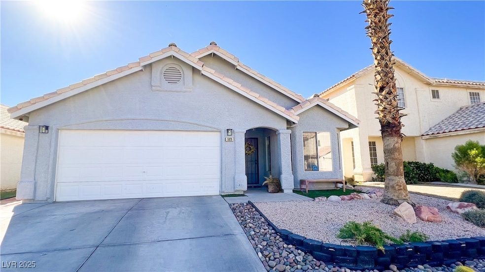 View of front of home featuring concrete driveway,