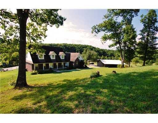 Exterior Front. House & cedar shop.