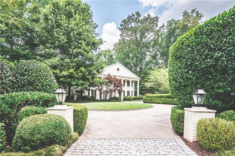 Courtyard entrance with the driveway going around to the back of the house
