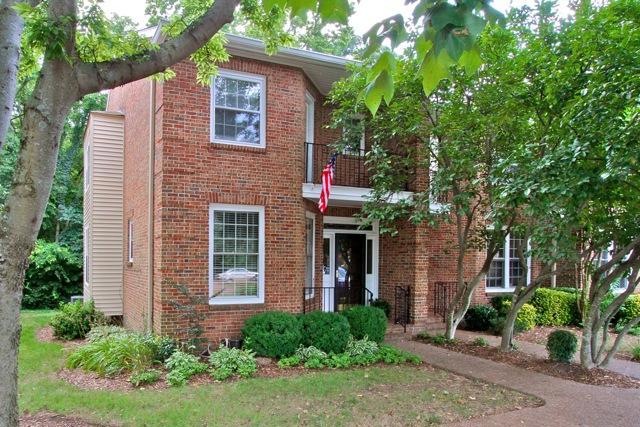 Come home to this beautiful brick end unit townhome that features 3 outdoor spaces and is in a prime Green Hills location.