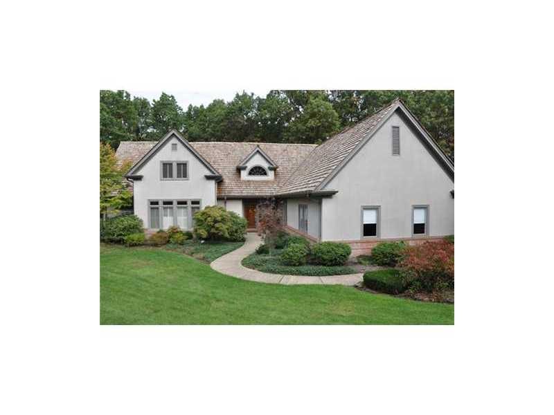 Exterior Front. Lush surroundings provide privacy