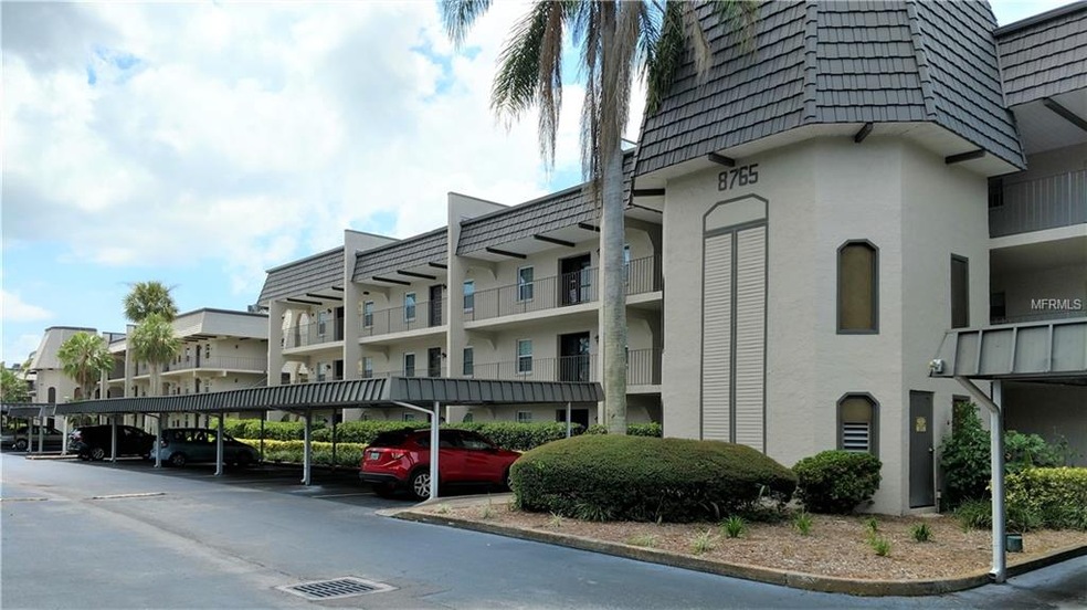Building exterior and covered parking.