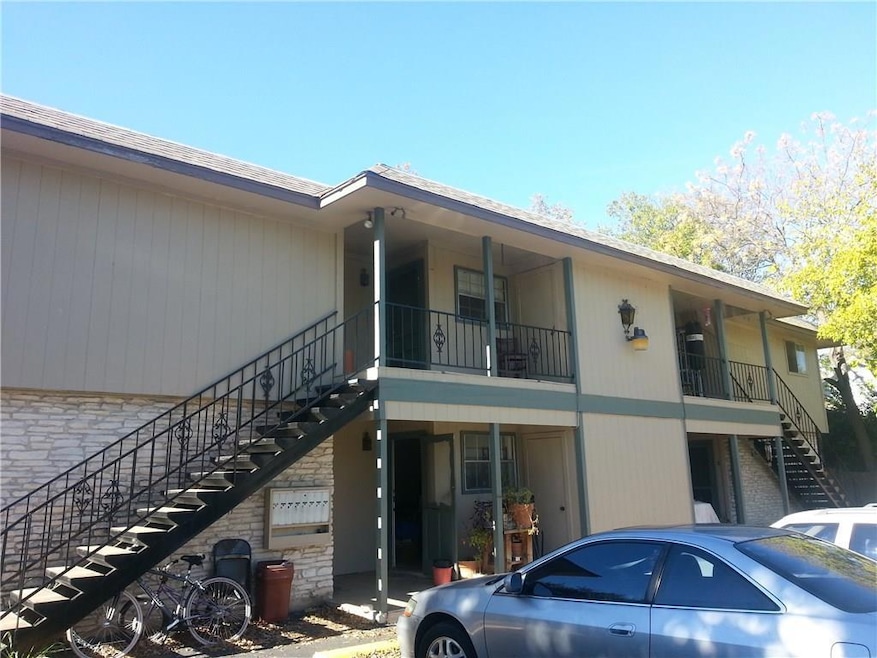 View of property with stairs